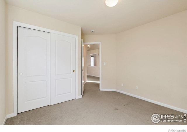 7747 Promontory Dr, Windsor, CO 80528 - unfurnished bedroom featuring carpet floors, baseboards, and a closet