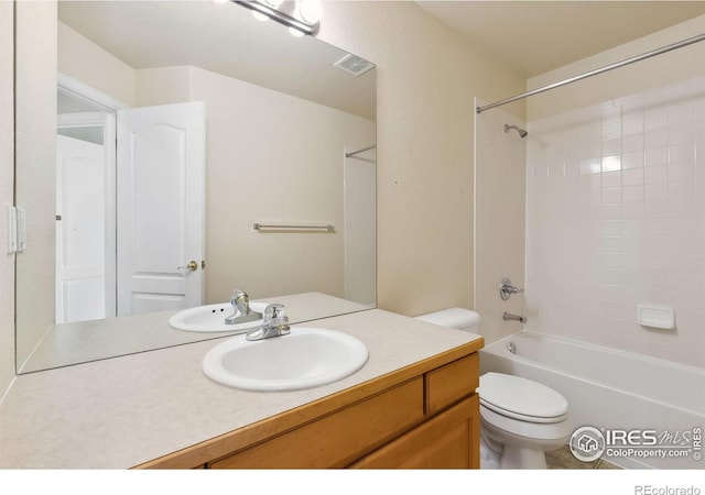 7747 Promontory Dr, Windsor, CO 80528 - bathroom featuring toilet, vanity, and bathtub / shower combination