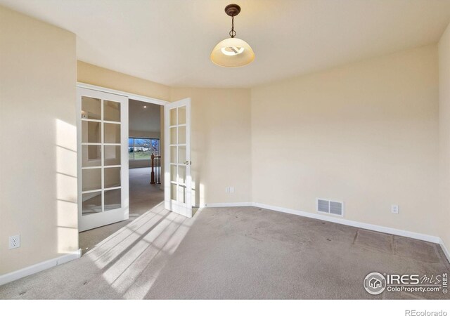 7747 Promontory Dr, Windsor, CO 80528 - unfurnished room with french doors, carpet flooring, and baseboards