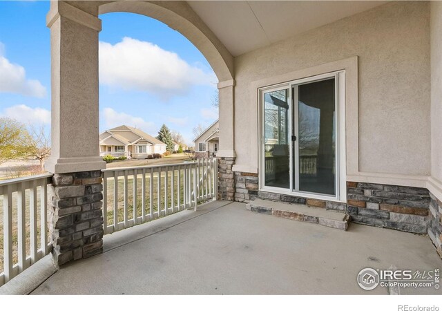 7747 Promontory Dr, Windsor, CO 80528 - view of patio featuring a porch