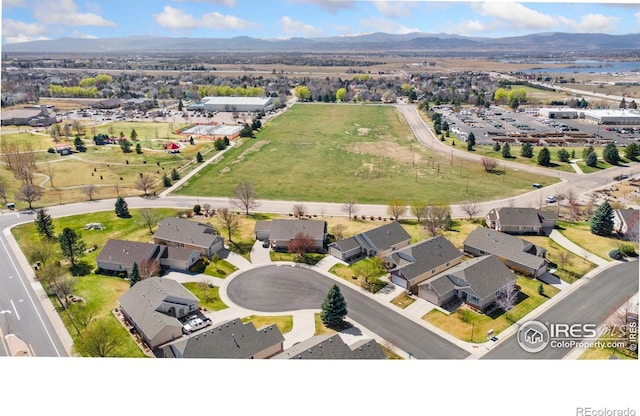 7747 Promontory Dr, Windsor, CO 80528 - drone / aerial view of a mountainous background
