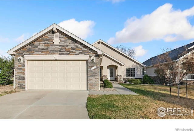 7747 Promontory Dr, Windsor, CO 80528 - view of front of house featuring stone siding, concrete driveway, a garage, a front yard, and stucco siding