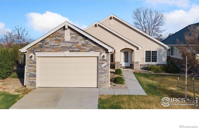 7747 Promontory Dr, Windsor, CO 80528 - view of front facade with stone siding, an attached garage, concrete driveway, a front lawn, and stucco siding