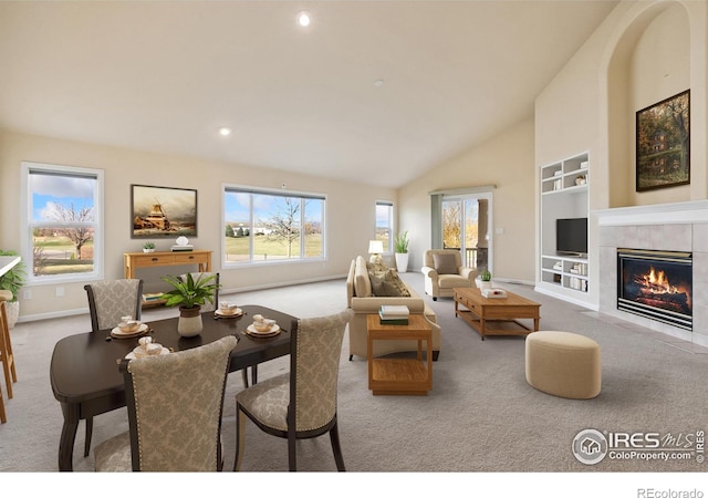 7747 Promontory Dr, Windsor, CO 80528 - living room with carpet, built in features, recessed lighting, baseboards, and a fireplace