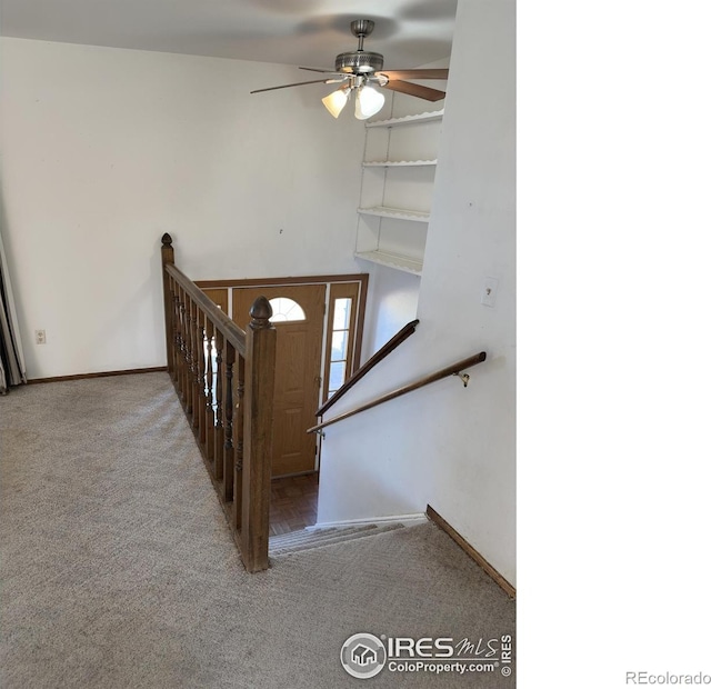 stairs featuring baseboards, carpet flooring, and ceiling fan