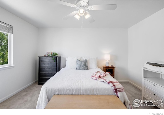bedroom with carpet floors, baseboards, and a ceiling fan