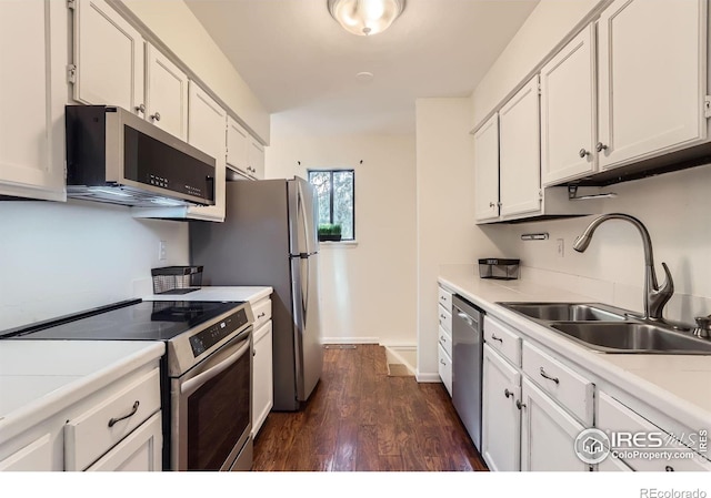 6396 Twin Lakes Rd, Boulder, CO 80301 - kitchen with stainless steel appliances, dark wood-style floors, white cabinets, and light countertops