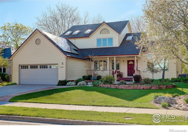4462 Wellington Rd, Boulder, CO 80301 - view of front of house with covered porch, roof mounted solar panels, an attached garage, driveway, and a front lawn