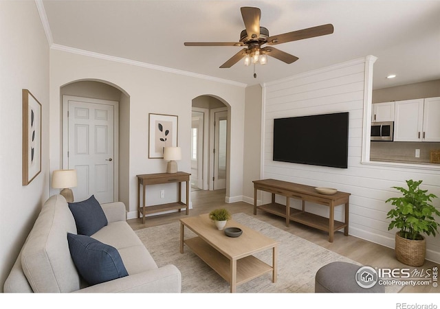 5620 Fossil Creek Pkwy Unit 4106, Fort Collins, CO 80525 - living area featuring light wood-type flooring, arched walkways, ceiling fan, ornamental molding, and baseboards