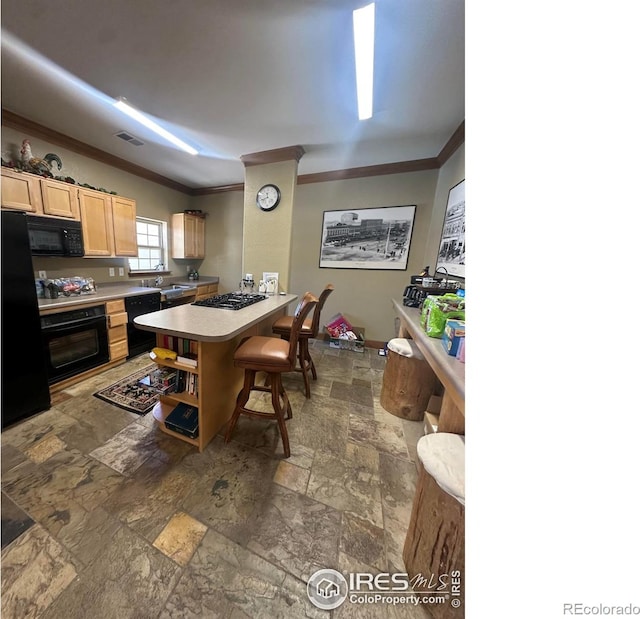 5620 Fossil Creek Pkwy Unit 4106, Fort Collins, CO 80525 - kitchen with black appliances, ornamental molding, stone tile flooring, a breakfast bar area, and light countertops