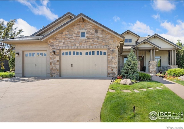 6701 Clovis Ct, Timnath, CO 80547 - craftsman-style house featuring stone siding, driveway, and a garage