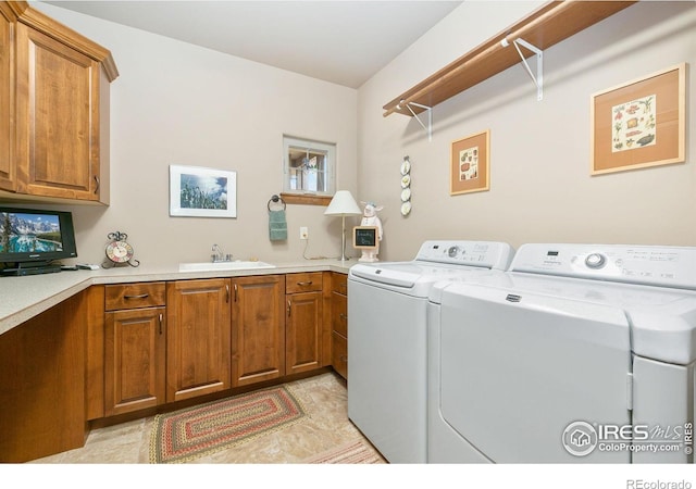 6701 Clovis Ct, Timnath, CO 80547 - washroom with washer and clothes dryer and cabinet space