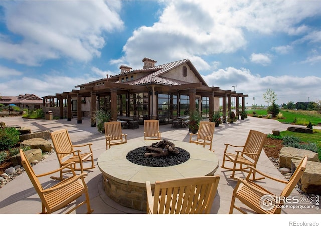 6701 Clovis Ct, Timnath, CO 80547 - view of patio with an outdoor fire pit