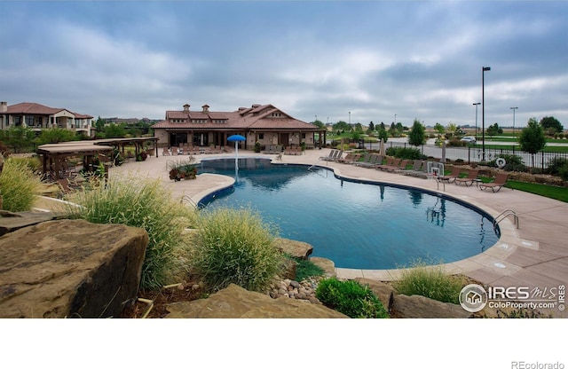 6701 Clovis Ct, Timnath, CO 80547 - community pool featuring a patio area