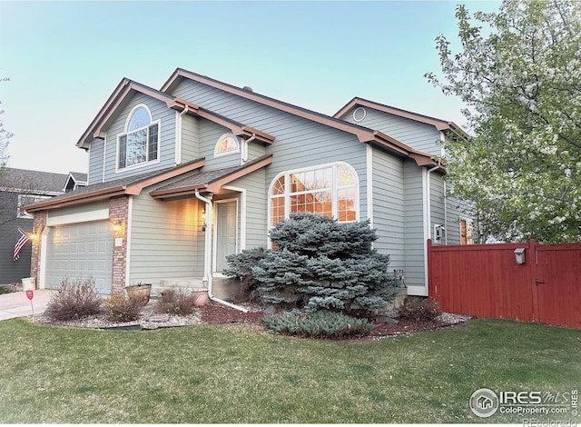 view of front of home with a garage and driveway