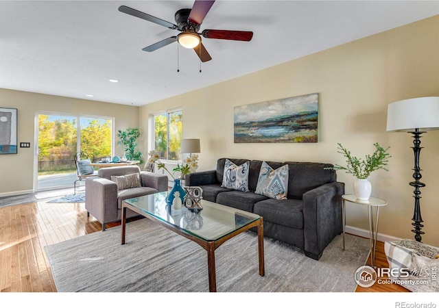 217 Park St, Lyons, CO 80540 - living area with wood finished floors, baseboards, a ceiling fan, and recessed lighting