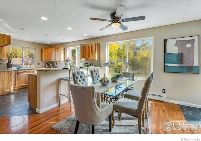 217 Park St, Lyons, CO 80540 - dining area with a baseboard radiator, healthy amount of natural light, recessed lighting, and baseboards