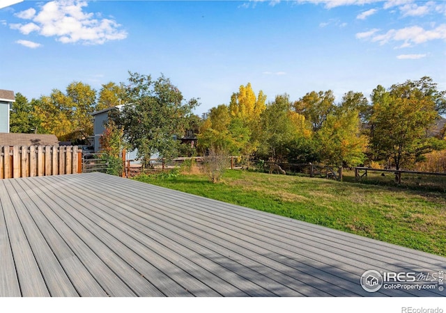 217 Park St, Lyons, CO 80540 - wooden terrace with view of wooded area