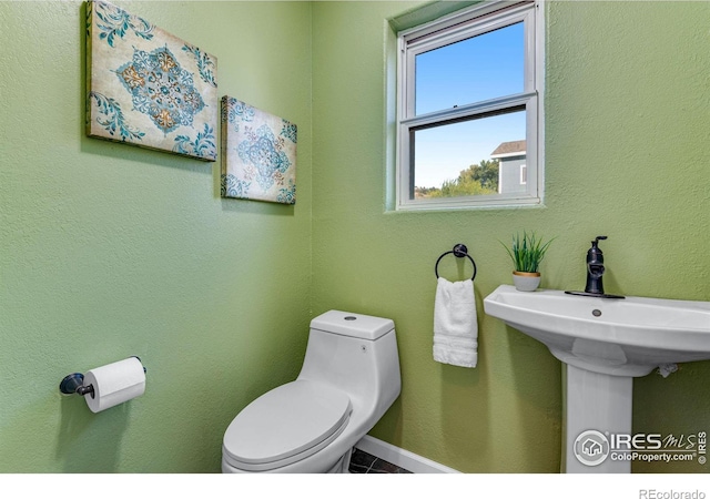 217 Park St, Lyons, CO 80540 - bathroom featuring toilet and tile patterned flooring