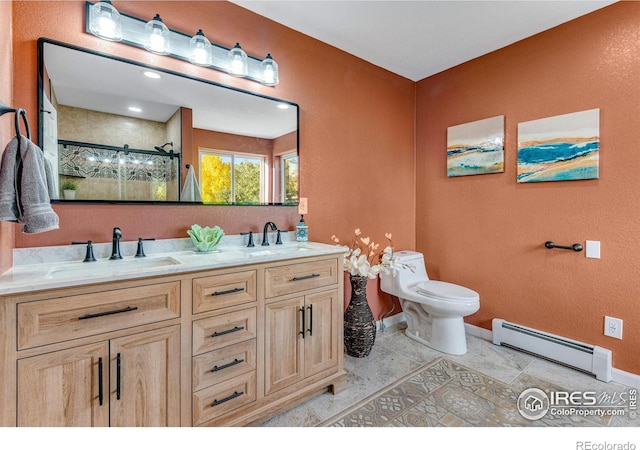 217 Park St, Lyons, CO 80540 - full bathroom featuring a baseboard heating unit, baseboards, toilet, a shower stall, and double vanity