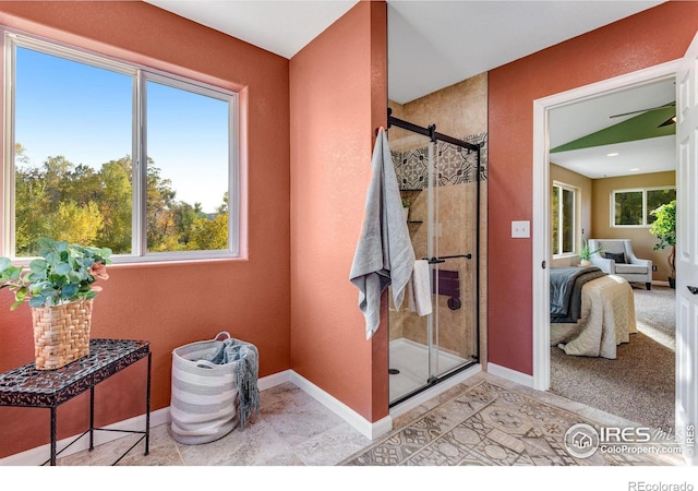 217 Park St, Lyons, CO 80540 - full bathroom featuring ensuite bathroom, a stall shower, and baseboards