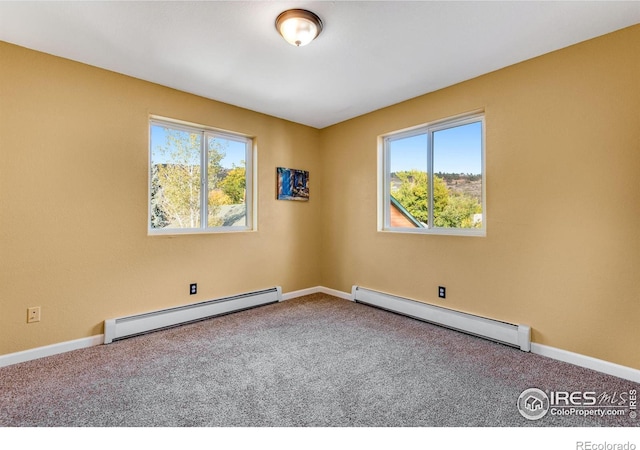 217 Park St, Lyons, CO 80540 - empty room with baseboard heating, a baseboard radiator, carpet, and baseboards