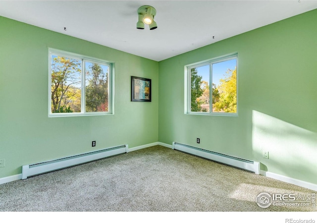 217 Park St, Lyons, CO 80540 - carpeted spare room featuring a baseboard radiator, baseboard heating, healthy amount of natural light, and baseboards