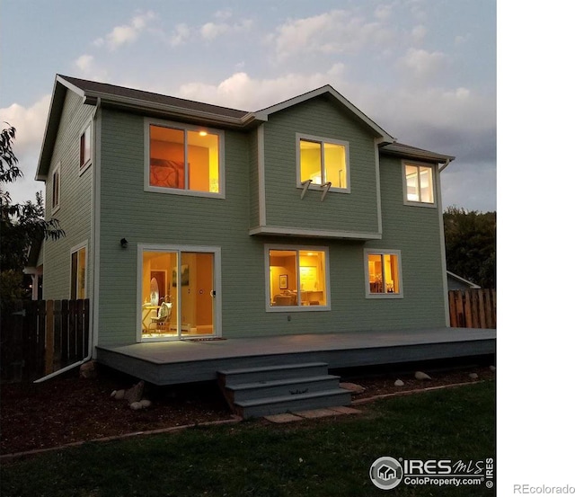 217 Park St, Lyons, CO 80540 - rear view of house featuring fence and a wooden deck