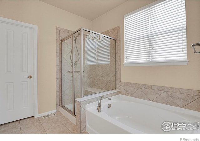 full bathroom featuring visible vents, a stall shower, and a garden tub