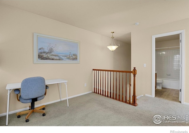 office space with carpet and baseboards