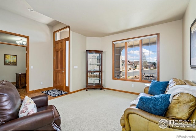 6741 Bandon Dunes Dr, Windsor, CO 80550 - carpeted living room featuring baseboards
