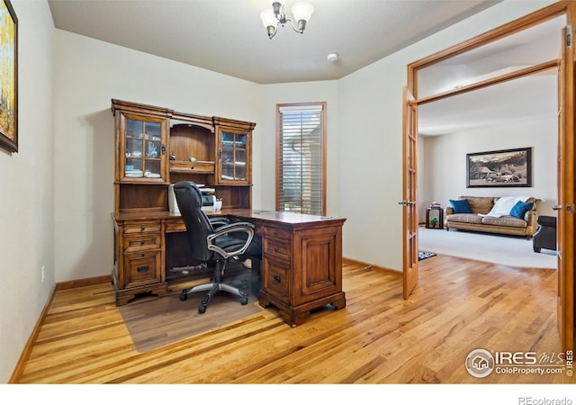 6741 Bandon Dunes Dr, Windsor, CO 80550 - office area with light wood-style flooring and baseboards