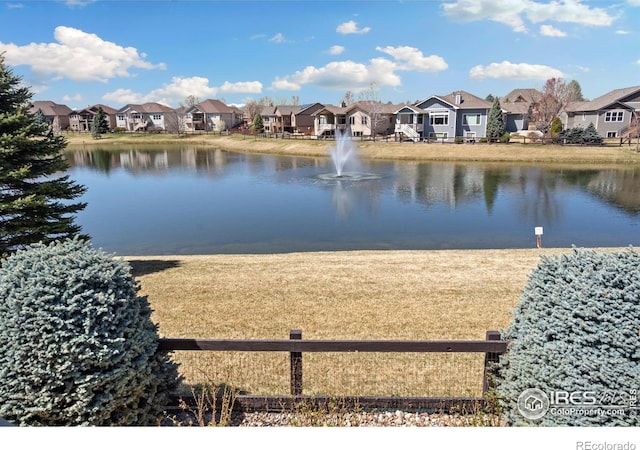 6741 Bandon Dunes Dr, Windsor, CO 80550 - property view of water featuring a residential view
