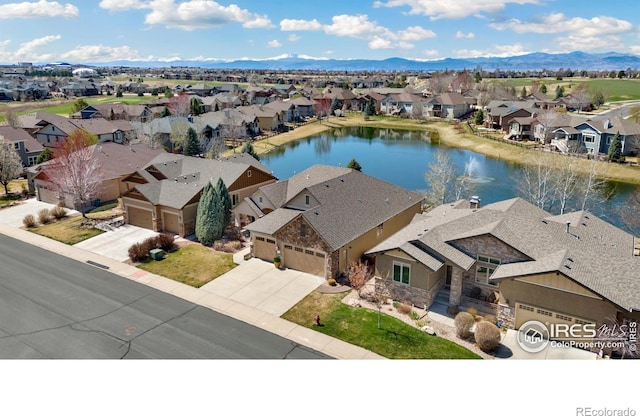 6741 Bandon Dunes Dr, Windsor, CO 80550 - bird's eye view with a water and mountain view and a residential view