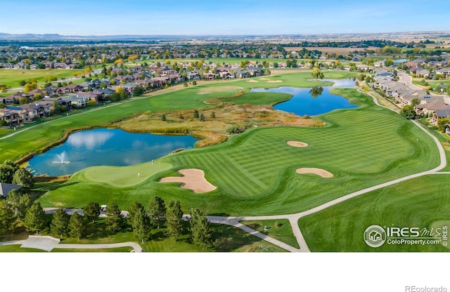 6741 Bandon Dunes Dr, Windsor, CO 80550 - drone / aerial view with view of golf course, a residential view, and a water view