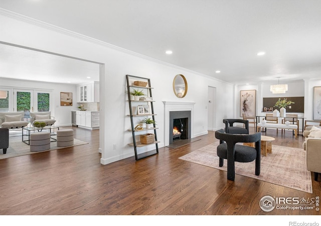 545 S Harrison Ln, Denver, CO 80209 - living room with a fireplace with flush hearth, crown molding, baseboards, recessed lighting, and dark wood-type flooring