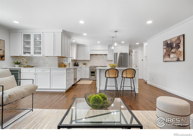 545 S Harrison Ln, Denver, CO 80209 - living room featuring beverage cooler, recessed lighting, baseboards, wood finished floors, and ornamental molding
