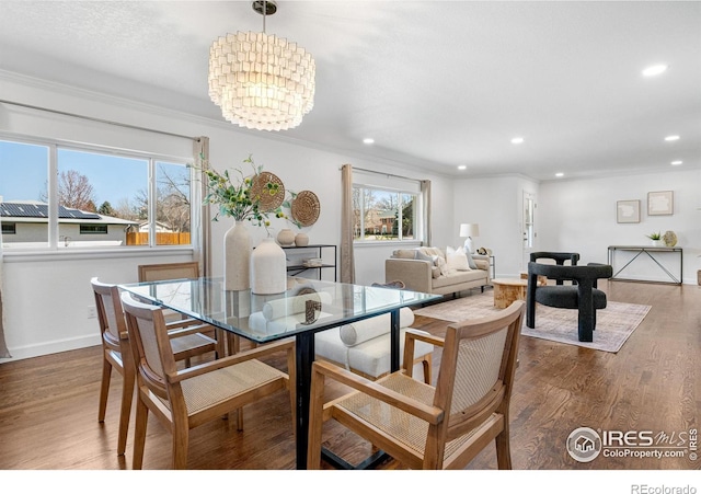 545 S Harrison Ln, Denver, CO 80209 - dining area with recessed lighting, an inviting chandelier, ornamental molding, and wood finished floors