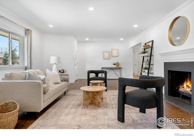 545 S Harrison Ln, Denver, CO 80209 - living room featuring crown molding, recessed lighting, a tiled fireplace, and wood finished floors