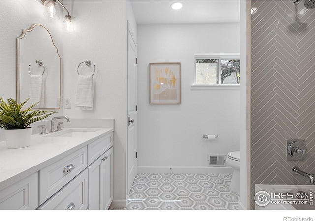 545 S Harrison Ln, Denver, CO 80209 - bathroom with visible vents, vanity, toilet, baseboards, and recessed lighting