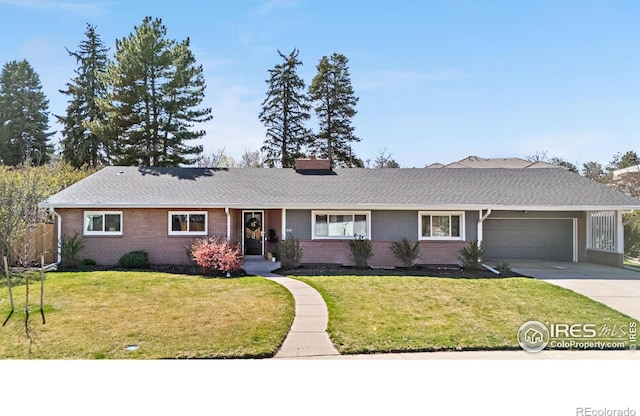 545 S Harrison Ln, Denver, CO 80209 - single story home featuring an attached garage, a front yard, driveway, and brick siding