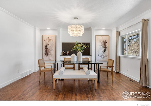 545 S Harrison Ln, Denver, CO 80209 - dining area featuring crown molding, a chandelier, visible vents, and wood finished floors