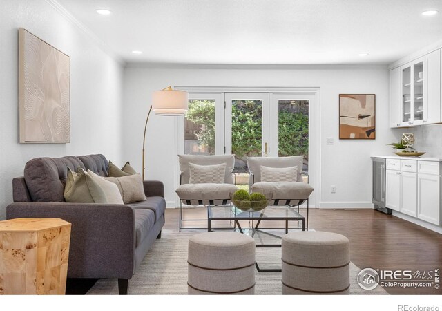 545 S Harrison Ln, Denver, CO 80209 - living area featuring wood finished floors, baseboards, wine cooler, ornamental molding, and recessed lighting