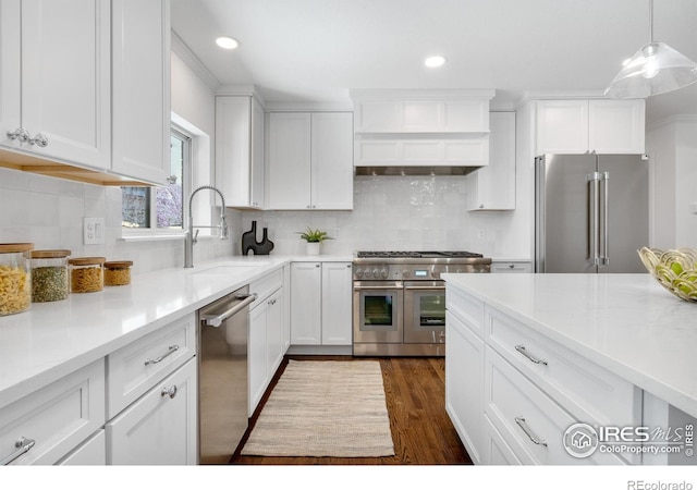 545 S Harrison Ln, Denver, CO 80209 - kitchen with a sink, white cabinets, recessed lighting, and high quality appliances