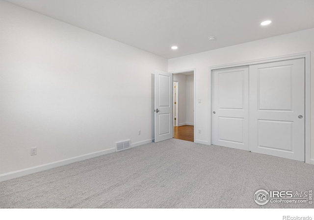 545 S Harrison Ln, Denver, CO 80209 - unfurnished bedroom with carpet floors, recessed lighting, baseboards, visible vents, and a closet