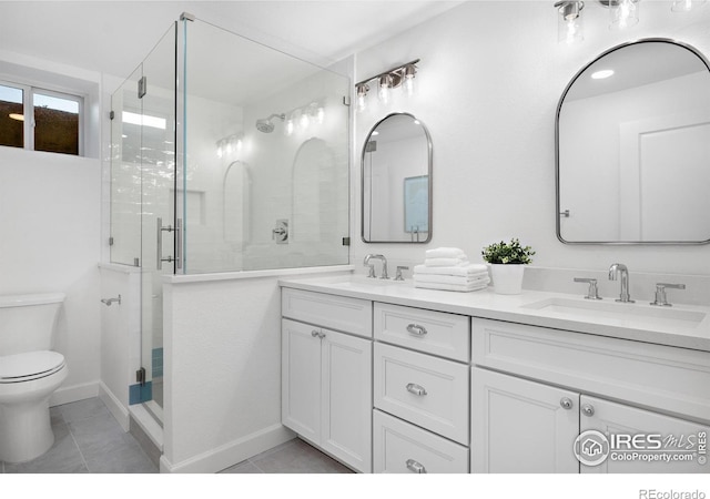 545 S Harrison Ln, Denver, CO 80209 - bathroom featuring a sink, tile patterned flooring, a stall shower, and toilet
