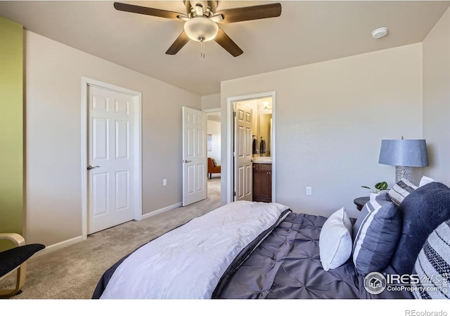 61 Avocet Ct, Longmont, CO 80501 - bedroom with carpet, baseboards, ensuite bath, and a ceiling fan