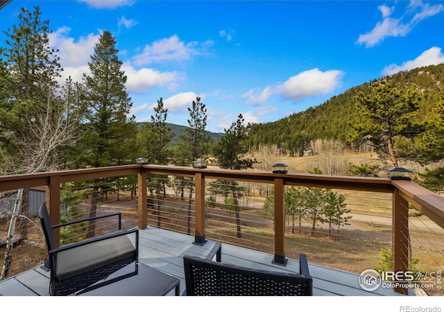 712 Aspen Dr, Lyons, CO 80540 - wooden deck featuring a mountain view