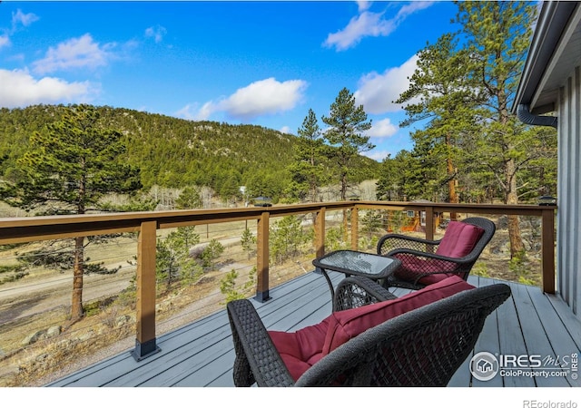 712 Aspen Dr, Lyons, CO 80540 - wooden deck with a view of trees