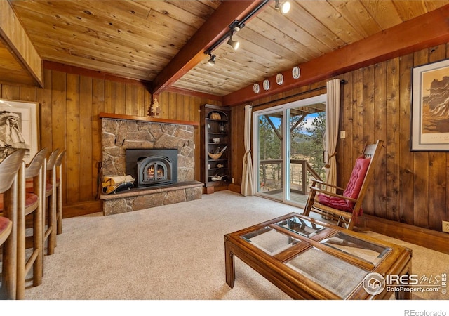 712 Aspen Dr, Lyons, CO 80540 - living area with track lighting, wooden ceiling, beam ceiling, wood walls, and carpet flooring